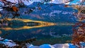 Beautiful panoramic view at Austrian alps lake. Old vintage rural houses and wooden boat houses in alps at Hallstatt mountain lake Royalty Free Stock Photo
