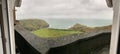 Beautiful panoramic view from a balcony of sea and cliffs under a cloudy sky Royalty Free Stock Photo