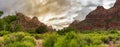 Beautiful panoramic view of the cliffs at the Zion National Park, Utah, the USA under the cloudy sky Royalty Free Stock Photo