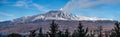 A beautiful panoramic view of the eruption of volcano Etna with smoke and snow is in the photo in winter in Sicily Royalty Free Stock Photo