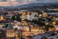 Beautiful panoramic view of evening Tbilisi, capital of Georgia. City colorful lights, river,cathedral,old buildings at a nice