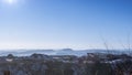 Beautiful panoramic view of an excavation site on a mountain with an excavator working Royalty Free Stock Photo