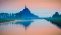 Beautiful panoramic view of famous Le Mont Saint-Michel tidal island at sunrise. Normandy, northern France Royalty Free Stock Photo