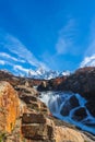 Beautiful panoramic view of Fitz roy mountains with white snow peak with colorful red orange leaves tree in sunny blue sky day, Royalty Free Stock Photo