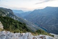 Beautiful panoramic view of the mountains with bushes, rocks and a blue-green river on a summer day at sunset. Sulak Canyon. Royalty Free Stock Photo