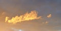 Beautiful panoramic view on orange and yellow sunset clouds in a dramatic looking sky Royalty Free Stock Photo