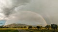 Beautiful panoramic view of a rainbow over Assisi town Umbria, Italy Royalty Free Stock Photo
