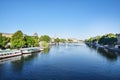 Beautiful panoramic view from the Seine River to the bridge and the city landscape on a sunny summer day. Paris, France Royalty Free Stock Photo