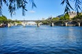 Beautiful panoramic view from the Seine River to the bridge and the city landscape on a sunny summer day. Paris, France Royalty Free Stock Photo