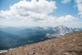 A beautiful view of the snow-capped mountains of the Carpathians from the top of Goverly in spring in a beautiful sunny