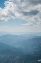 A beautiful view of the snow-capped mountains of the Carpathians from the top of Goverly in spring in a beautiful sunny