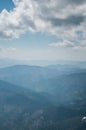 A beautiful view of the snow-capped mountains of the Carpathians from the top of Goverly in spring in a beautiful sunny