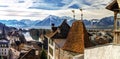 Beautiful panoramic view of Thun old city roofs and Alps on back Royalty Free Stock Photo