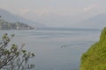 Beautiful panoramic view to the lake Como, lakefront, motorboat moving.