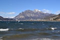 Seagulls are flying over the stormy lake Garlate. Royalty Free Stock Photo