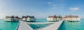 Beautiful panoramic view of the tropical island landscape with over water bungalows in luxury resort Royalty Free Stock Photo