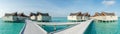 Beautiful panoramic view of the tropical island landscape with over water villas in luxury resort Royalty Free Stock Photo