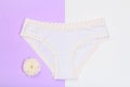 Beautiful women& x27;s panties on lilac and white background