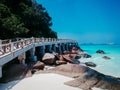 Beautiful paradise tropical beach with trees, white sand, granite rocks and turquoise water,