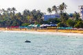 Beautiful paradise tropical Mirissa beach waves parasols tourists Sri Lanka