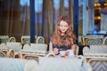 Beautiful Parisian woman in cafe