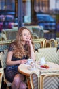 Beautiful Parisian woman in cafe Royalty Free Stock Photo