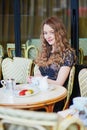 Beautiful Parisian woman in cafe Royalty Free Stock Photo