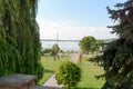 A beautiful park with ornamental trees and a beautiful embankment with a dock.