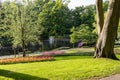 Beautiful Park With Tulip Beds, Green Lawn And Pond In Spring