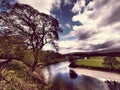 Beautiful part of Cumbria-Kirkby Lonsdale, where the river Luna is with an interesting background of trees and clouds