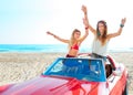 Beautiful party friend girls dancing in a car on the beach Royalty Free Stock Photo