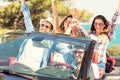 Beautiful party friend girls dancing in a car on the beach happy Royalty Free Stock Photo