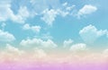 Beautiful pastel color with rainbow shade on white fluffy clouds, colorful blue sky on background, upward view and copy space