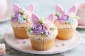 Beautiful pastel colored Easter cupcake with bunny ears, sugar flowers and frosting