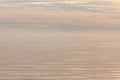 Beautiful pastel golden cloudy sunset over Baltic sea. Natural background. Latvia. Evening calm on the Sea. Copy space for text
