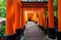 Beautiful path at Fushimi Inari shrine lined with thousands of Torii gates at Kyoto, Japan Royalty Free Stock Photo