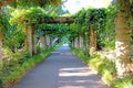 A beautiful path between sandstone columns in Royal Botanical Gardens in Sydney, Australia