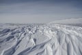 Beautiful patterns of sastrugi, parallel wavelike ridges caused by winds on surface of hard snow Royalty Free Stock Photo