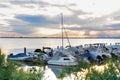 Beautiful and peaceful evening with sunset over the small sea harbour with yachts and boats Royalty Free Stock Photo