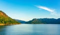 Beautiful and peaceful view of the river flowing through the mountains above the dam in the evening. River and mountain in Khun Royalty Free Stock Photo