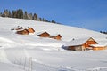 Beautiful peaceful winter landscape in the Frence Alps, at one of the ski stations, France. Several typical wooden houses Royalty Free Stock Photo