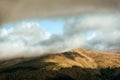 Beautiful peak in sunlight under the clouds