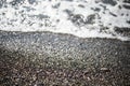 Beautiful pebble beach, small wave. Adler. Sochi. Royalty Free Stock Photo