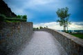 Beautiful pebble road along a stone fence Royalty Free Stock Photo