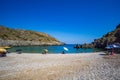 The beautiful pebbled beach of Chalkos in Kythera. Amazing scenery with crystal clear water and a small rocky gulf in Kythera