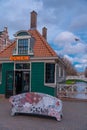 Beautiful pedestrian street in a town with colorful houses. Specific Dutch water channels on the side of the alleys in the city Royalty Free Stock Photo