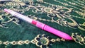 A beautiful pen with pink ink Royalty Free Stock Photo