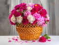 beautiful peons in a basket on the table Royalty Free Stock Photo