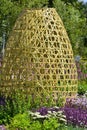 a beautiful perenial garden with bamboo ornament