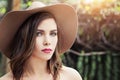 Beautiful perfect woman face outdoors. Pretty girl in hat, lifestyle portrait Royalty Free Stock Photo